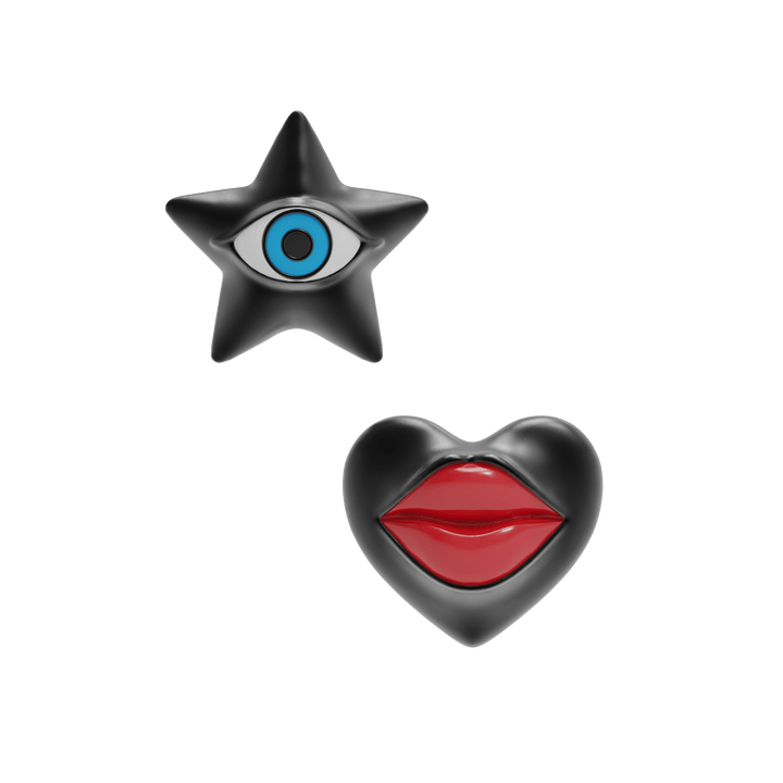 Star-shaped earring with eye design and heart-shaped earring with lips on a dark blue background