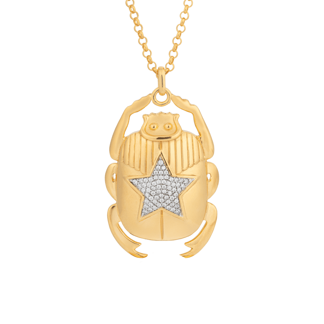 Gold scarab beetle pendant with star-shaped diamonds on a gold chain